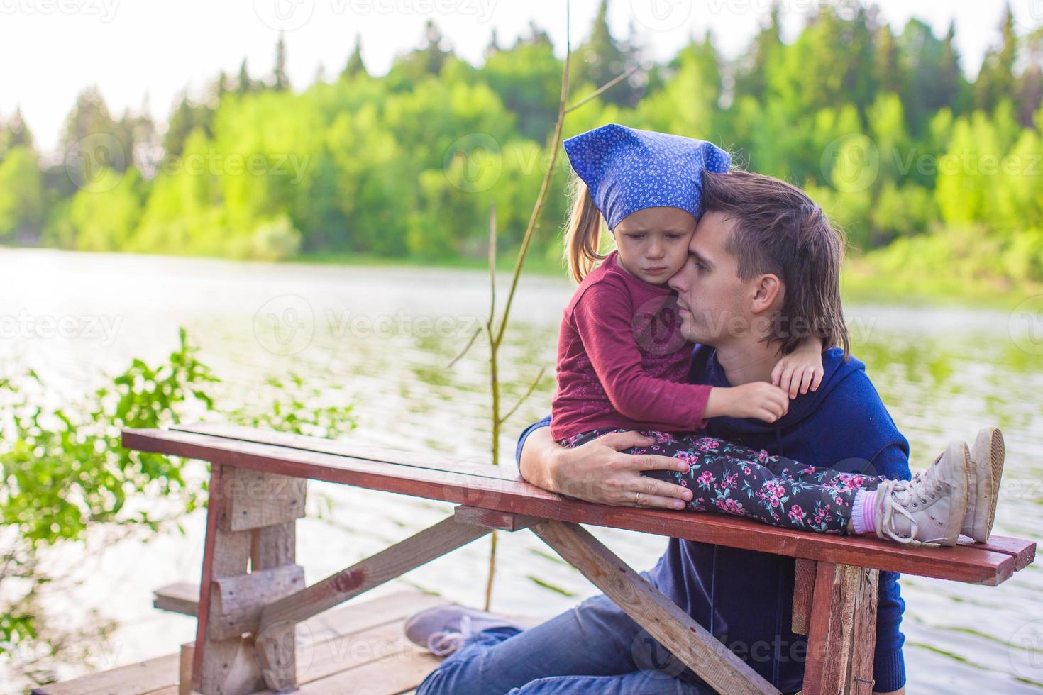 Young father and little adorable girl fishing photo