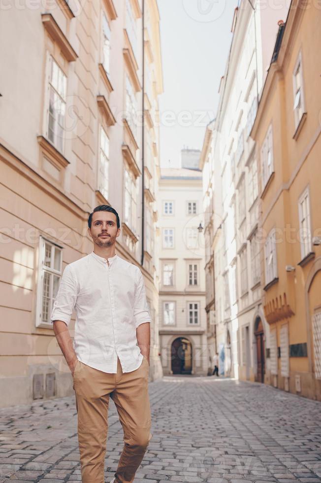 Young man background the old european city take selfie photo