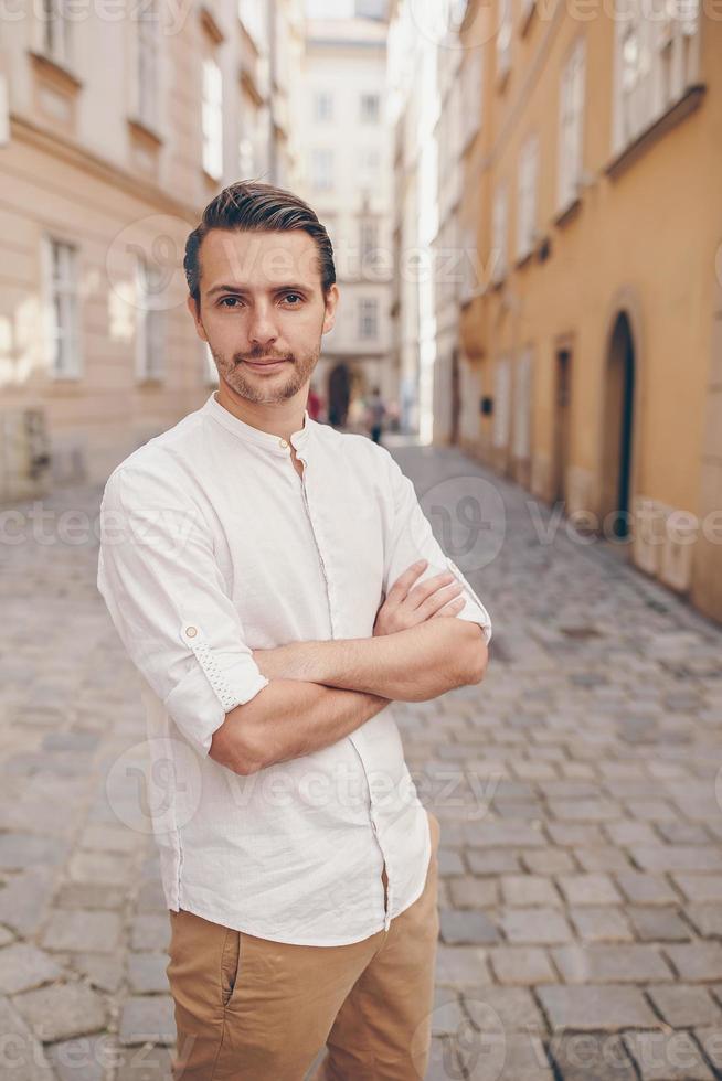 Young man background the old european city take selfie photo