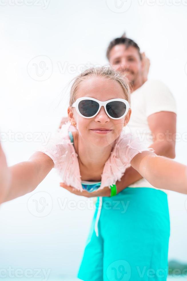 Little girl outdoors during summer vacation have fun with father photo