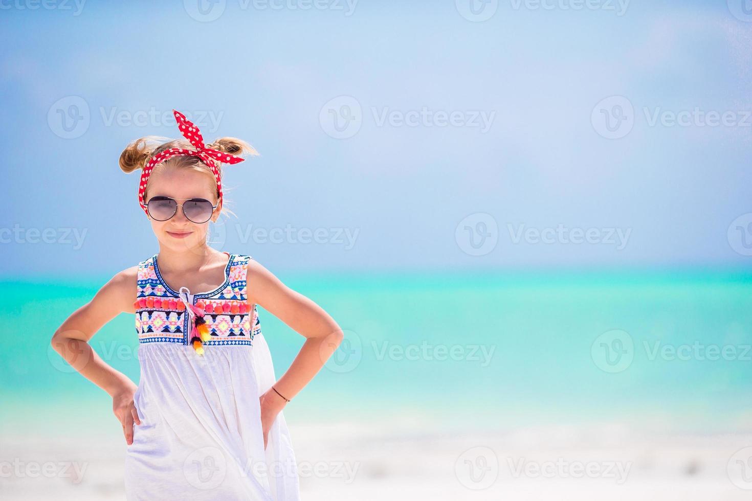 Portrait of little girl on the beach photo