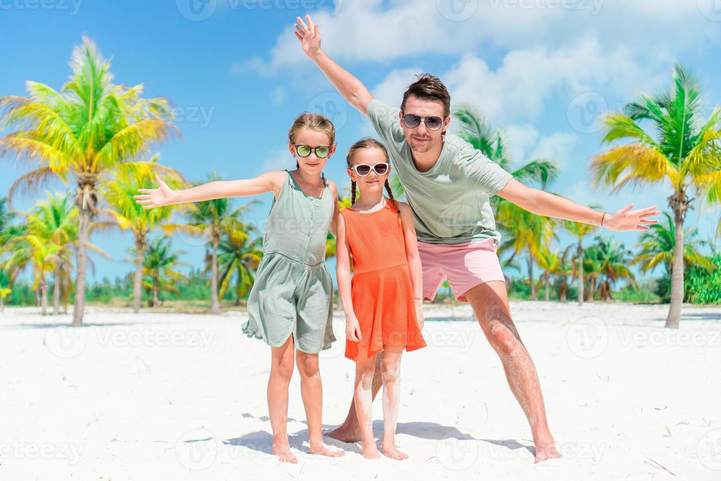 Father and kids enjoying beach summer vacation photo