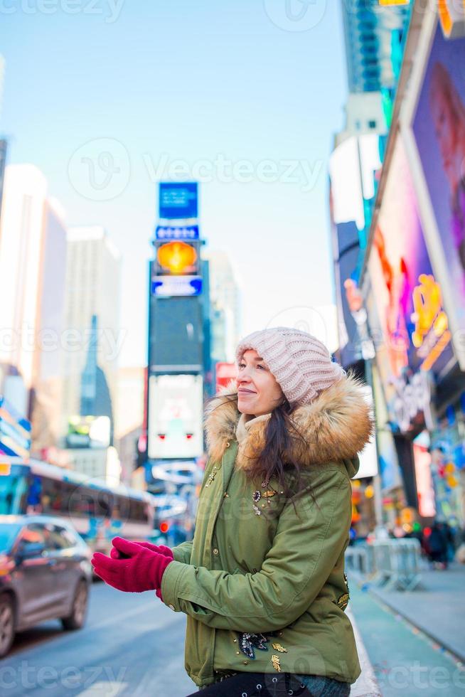 New York City woman as Times Square tourist or young happy woman visiting on Manhattan, New York City, New York, USA. photo