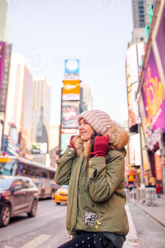 New York City woman as Times Square tourist or young happy woman visiting on Manhattan, New York City, New York, USA. photo