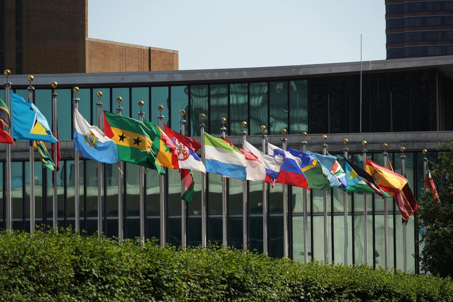 flags outside united nations building in new york photo