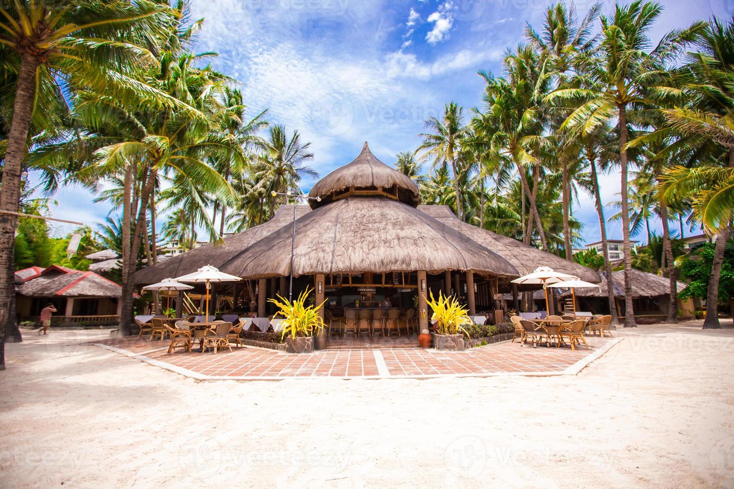 Tropical white sunny beach in beautiful exotic resort photo