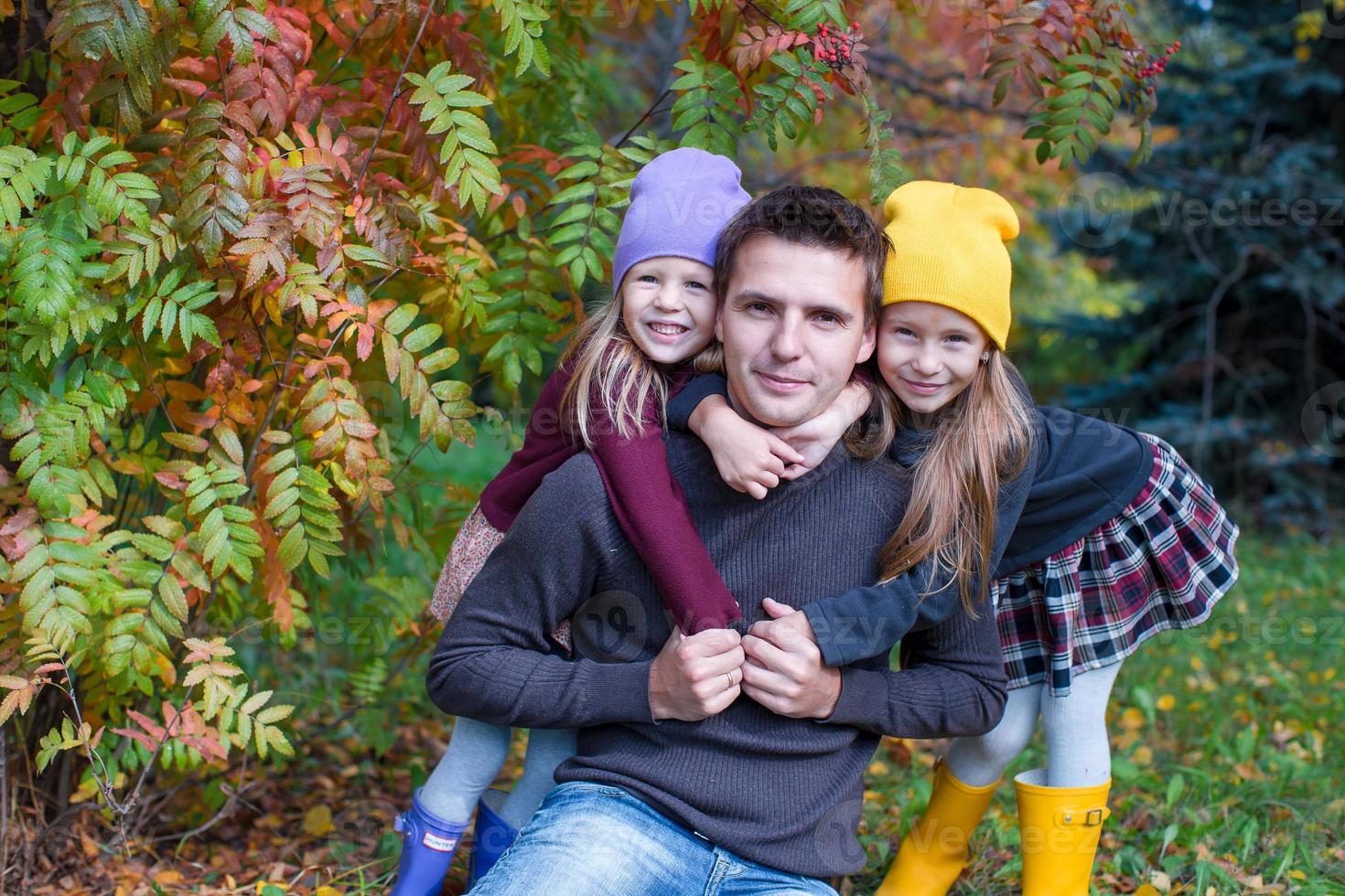 Happy family in autumn park outdoors photo