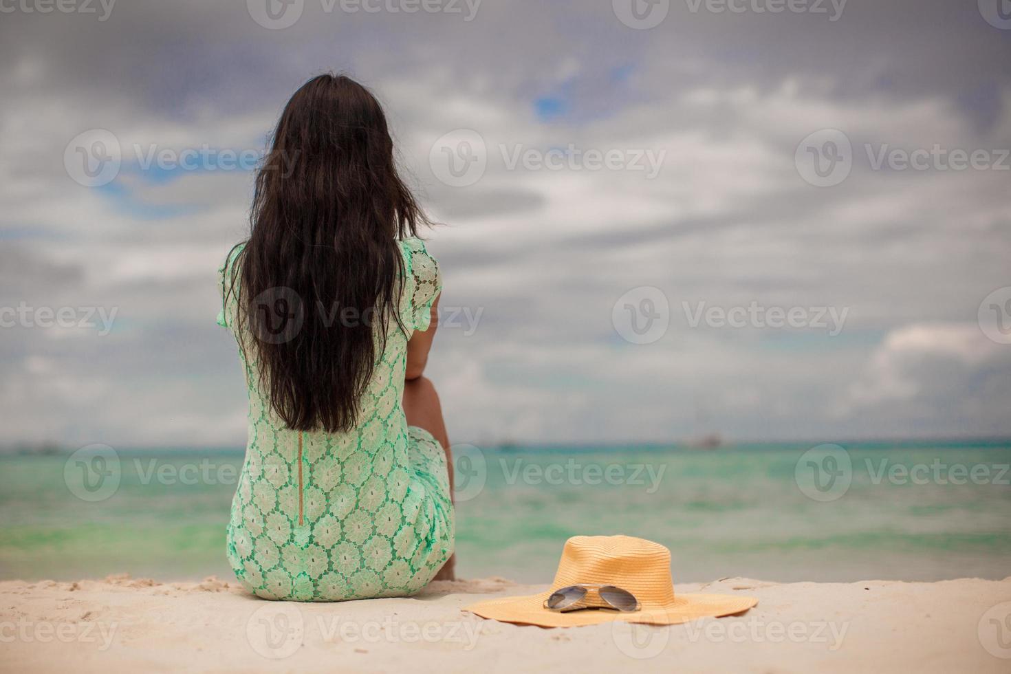 Beautiful young girl during beach tropical vacation photo