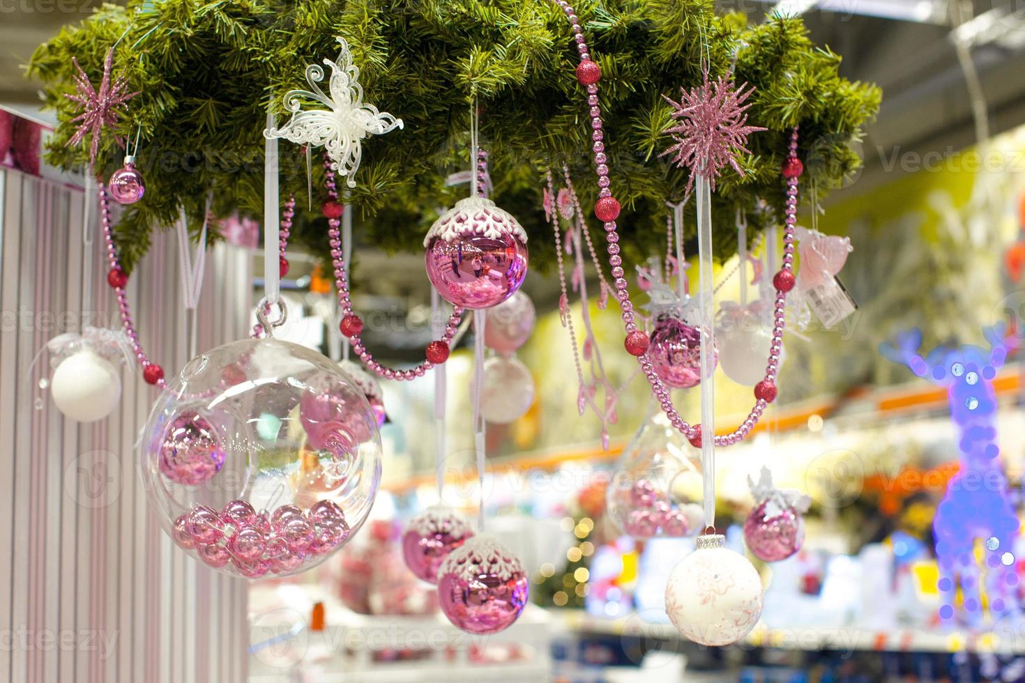 Christmas glass bowl with small pink balls at store photo