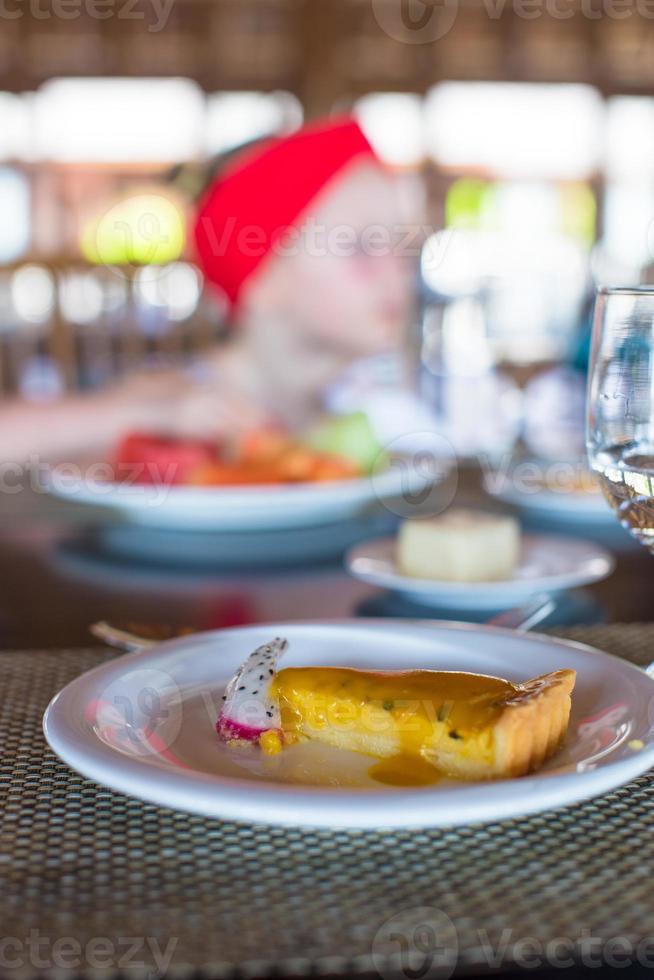 Delicious cake and juice served for breakfast at resort restaurant photo