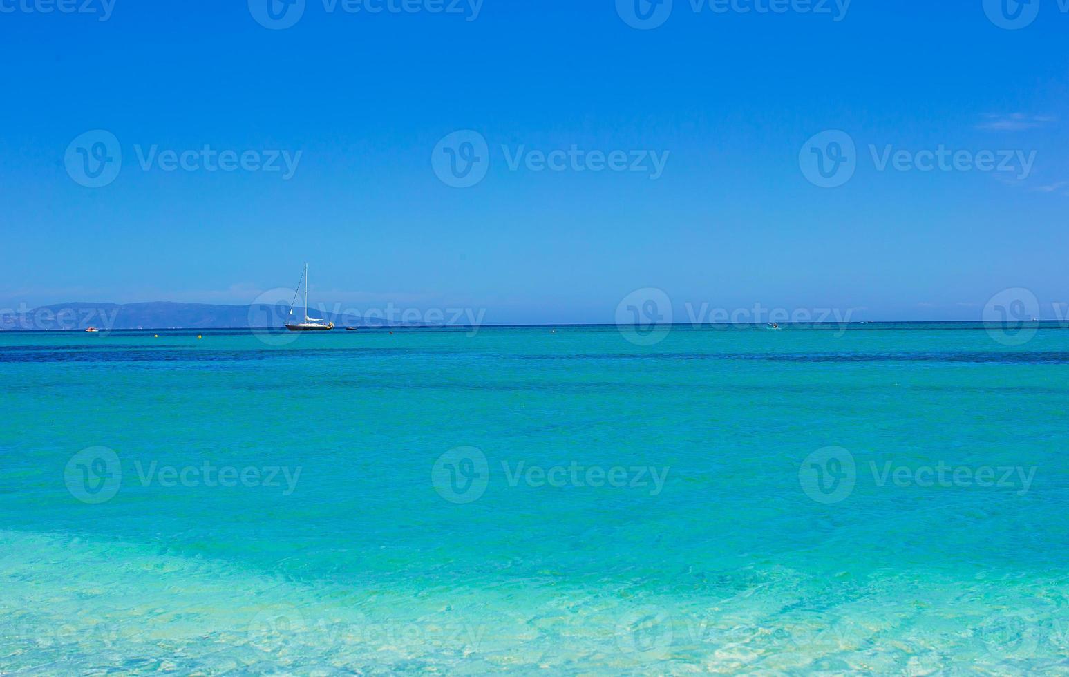 Incredibly clean turquoise water in the sea near tropical island photo