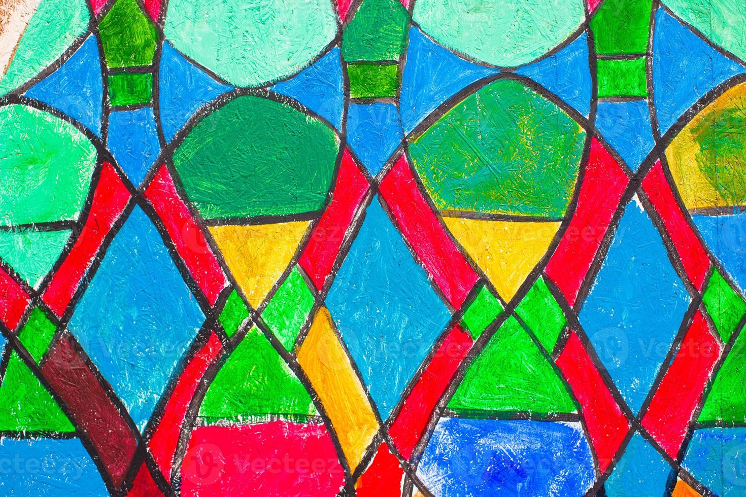 Stained glass church window in reddish tone photo
