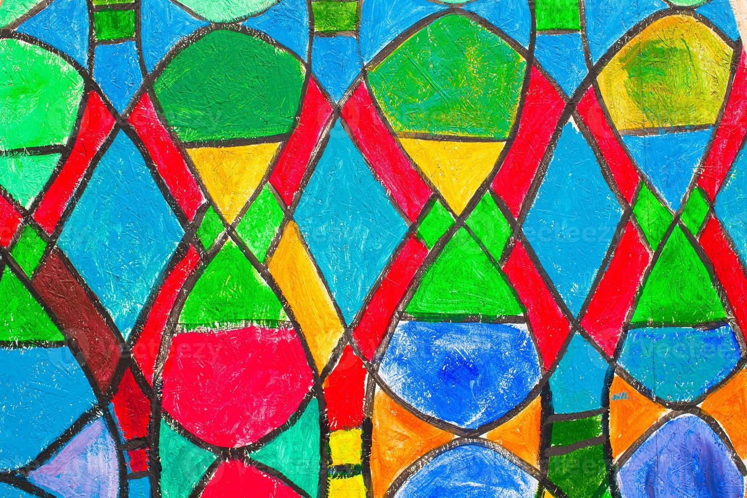 Stained glass church window in reddish tone photo