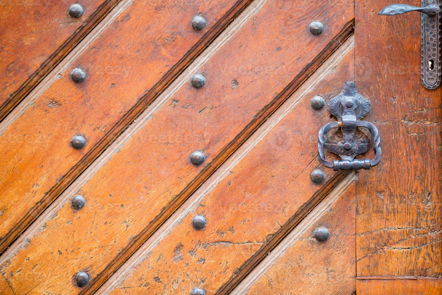 Closeup of brass handle of allwood door photo