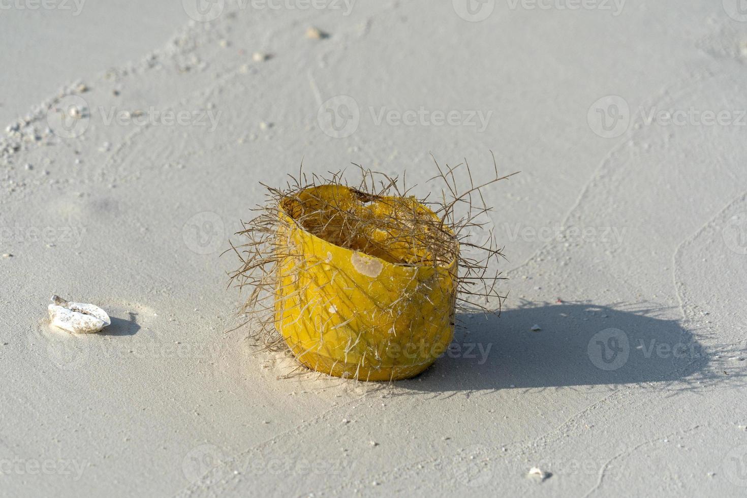 rubbish on tropical island paradise sandy beach photo