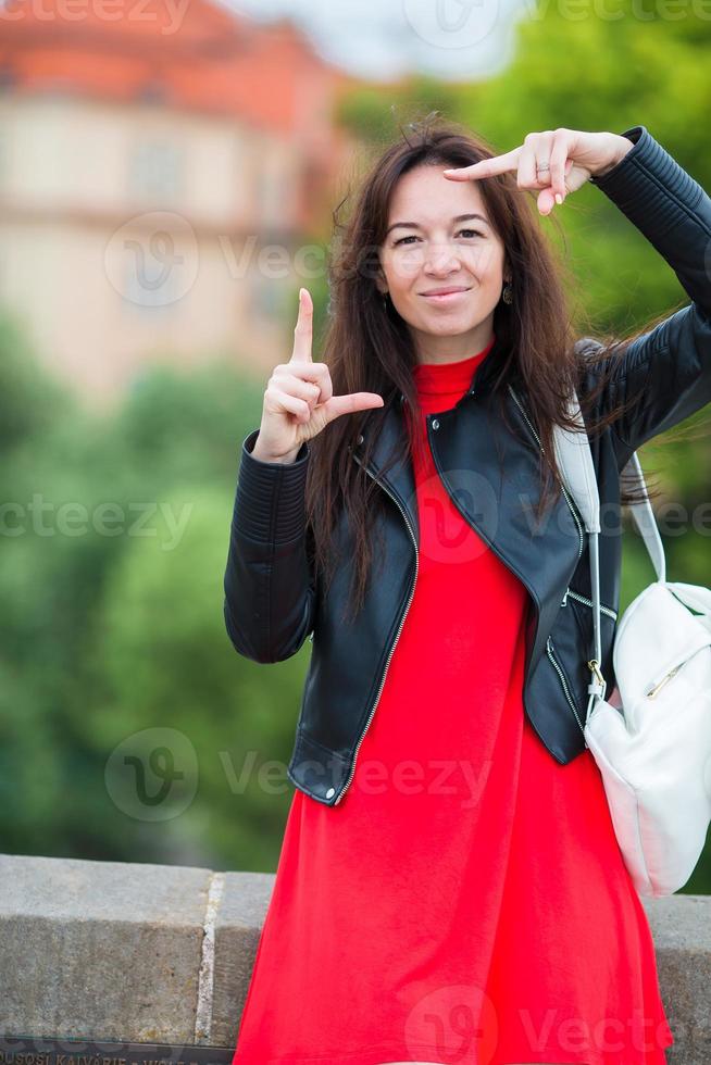 Happy young urban woman in european city. Caucasian tourist walking along the deserted streets of Europe. photo