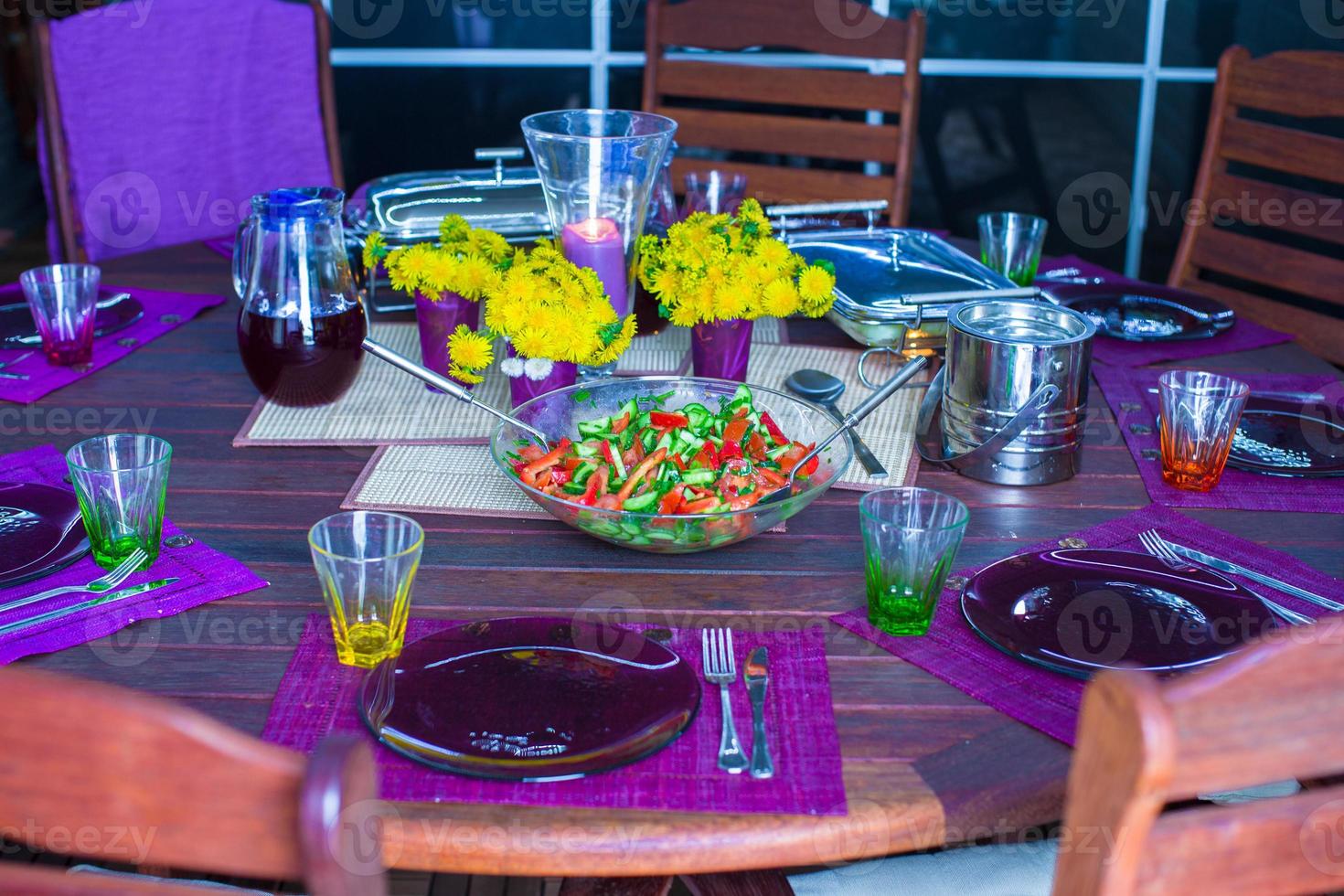 Beautiful home served table for dinner on the veranda photo