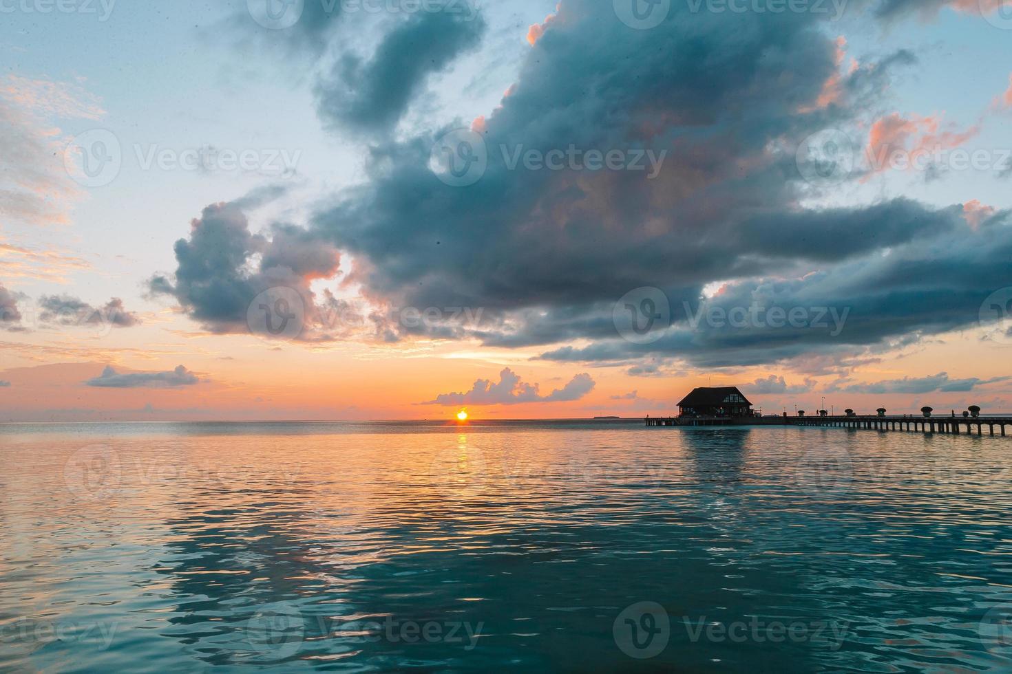 Beautiful colorful sunset in tropical island at Maldives photo