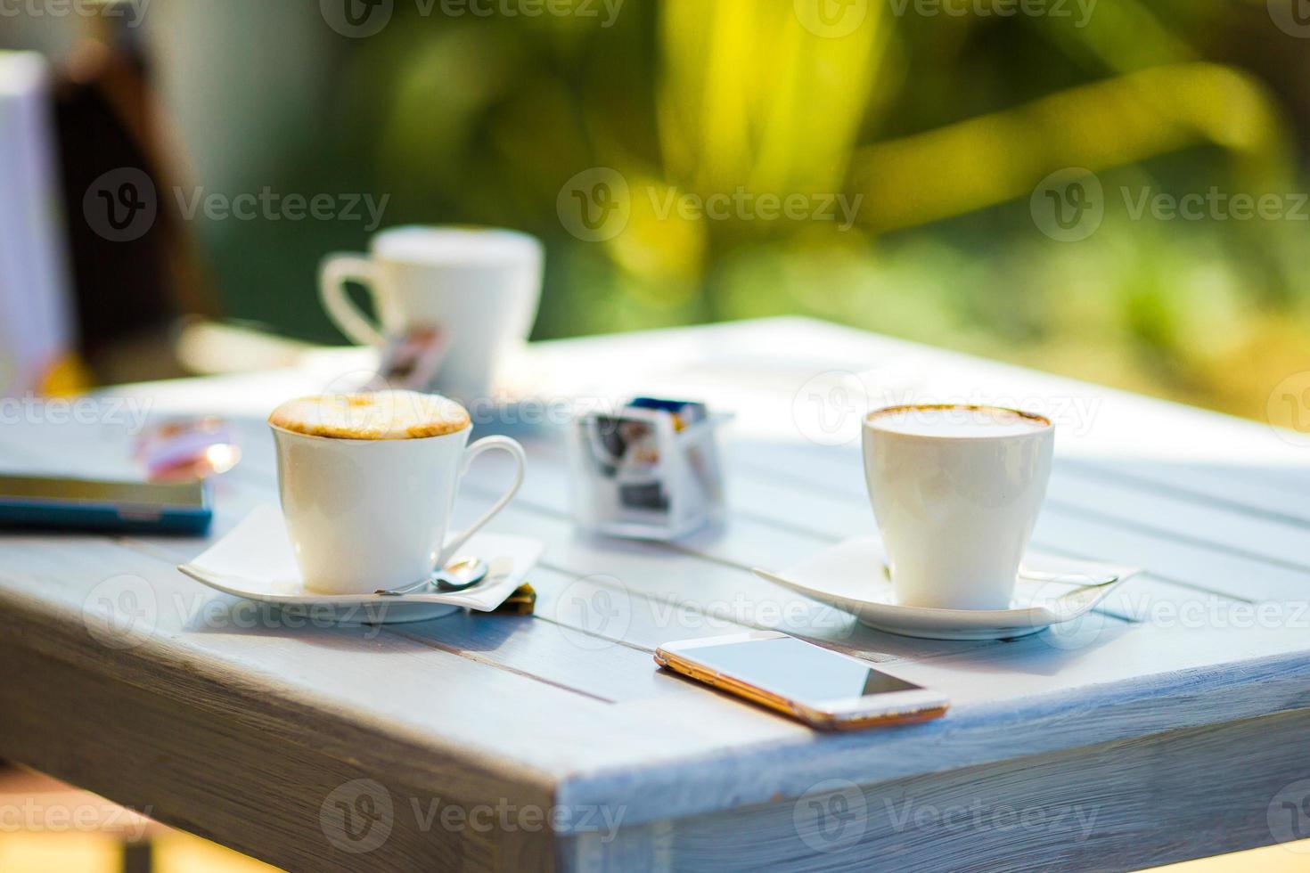 Lunch time, cup of coffee on table in restaraunt outdoor photo