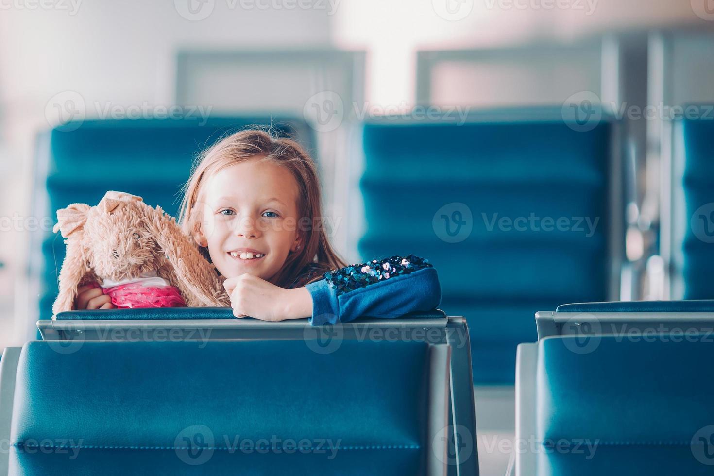 Little kid in airport waiting for boarding photo