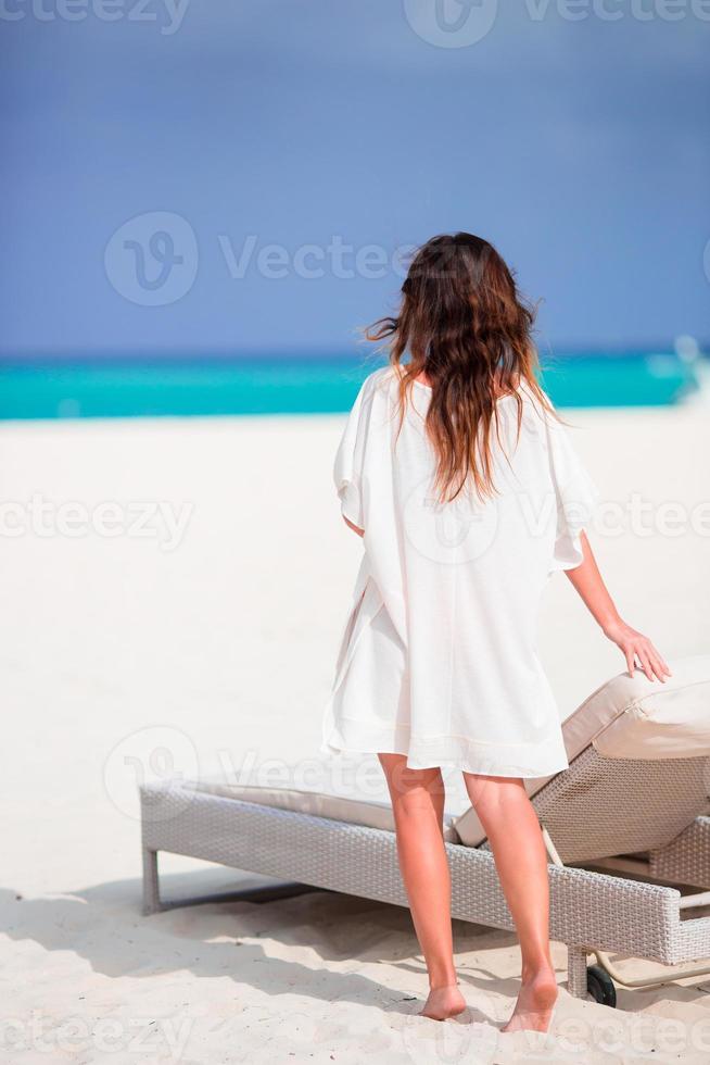 Young beautiful woman on beach vacation photo