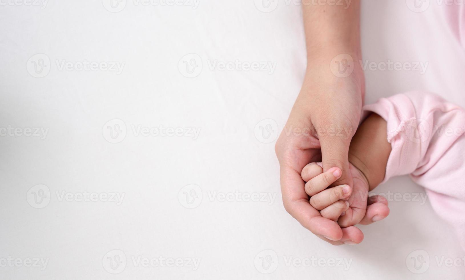 Mother Parenting and newborn birth life. Mom and baby boy playing in sunny bedroom, Family having fun together. childcare, maternity concept. photo