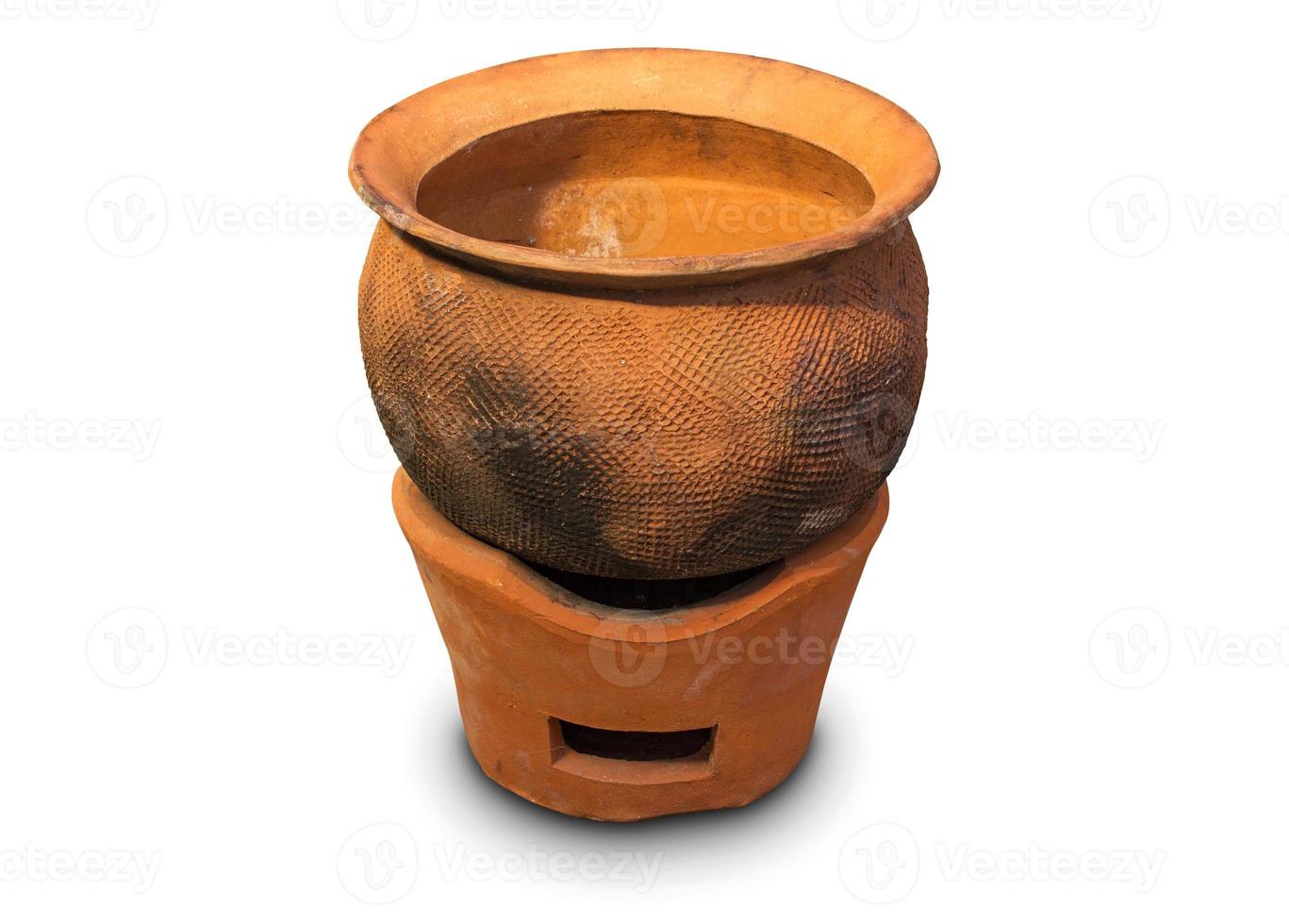 Clay pot on clay stove isolated on white background photo