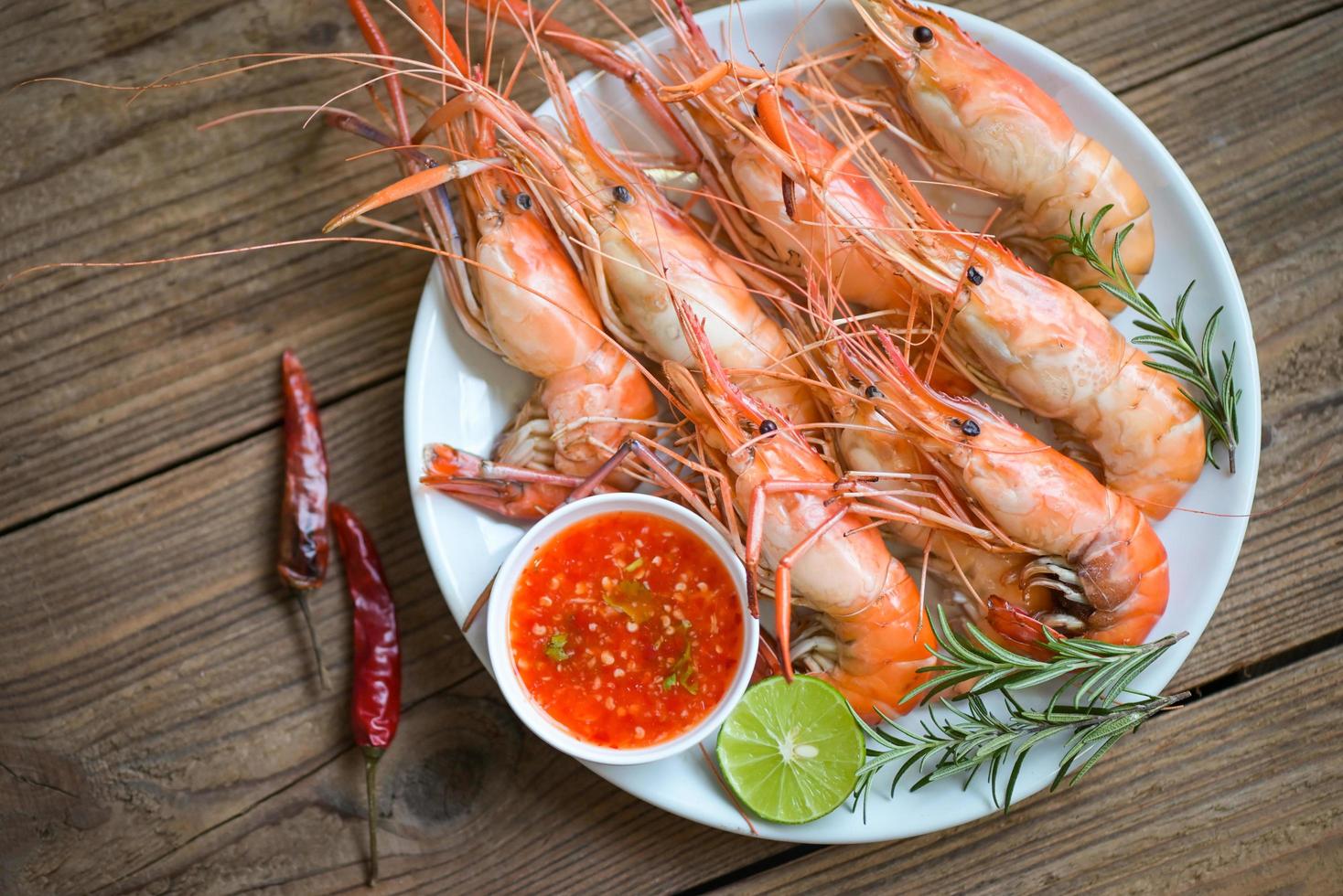shrimp grilled delicious seasoning spices on white plate background appetizing cooked shrimps baked prawns rosemary lemon lime pepper, Seafood shelfish with seafood sauce photo