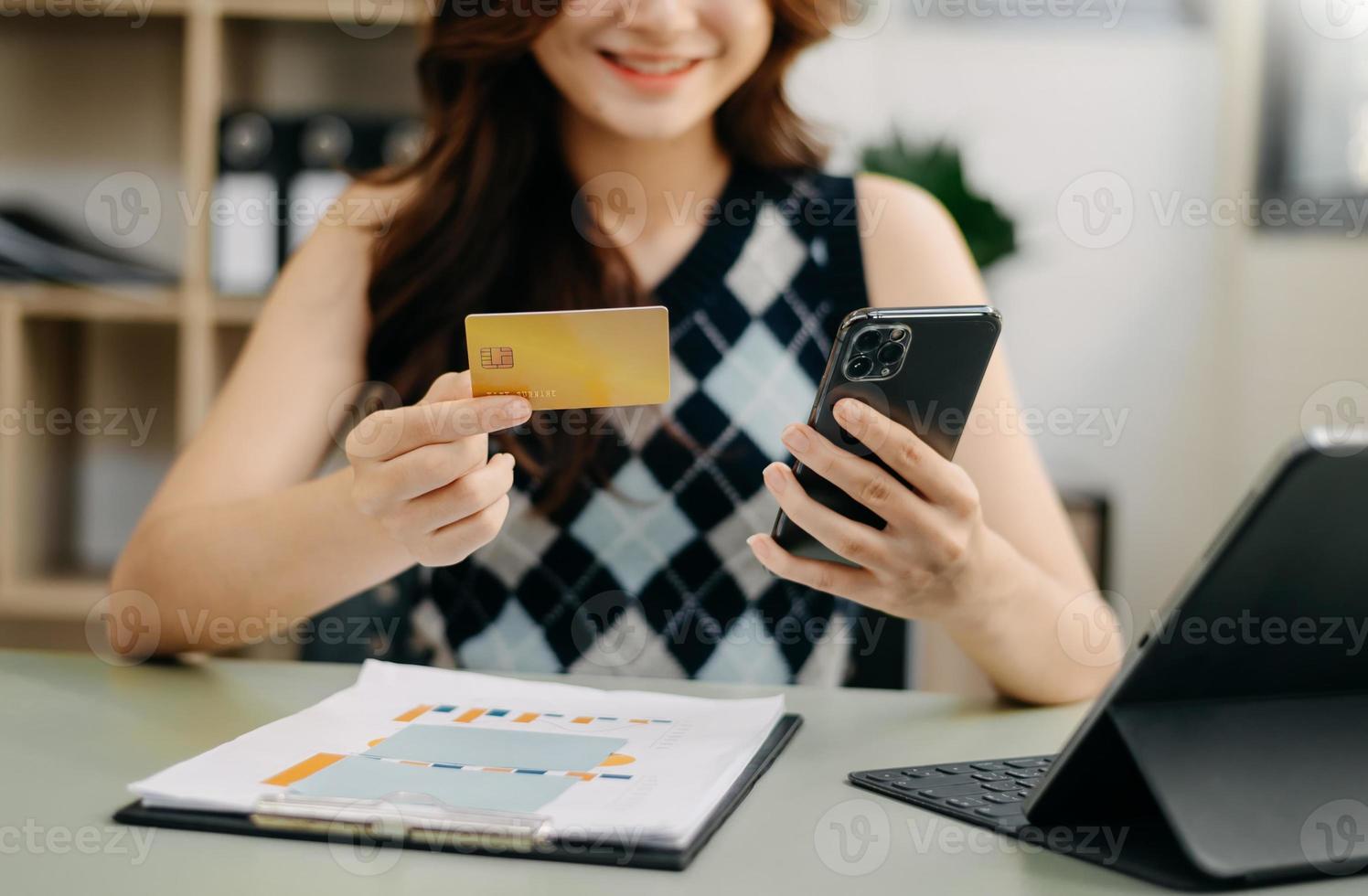 Business woman hands using smartphone and holding credit card as Online shopping photo