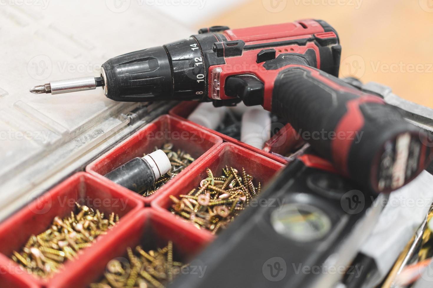 two electric screwdrivers or drills for screwing and drilling photo