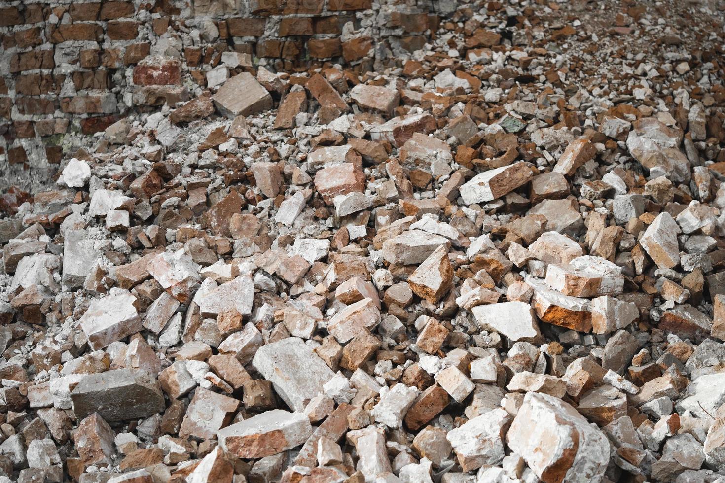 old broken red brick, destroyed wall of the building photo