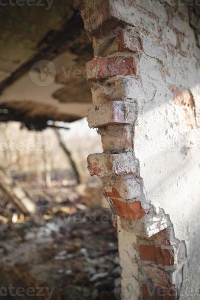 old ruined house, not suitable for living, fallen brick wall photo