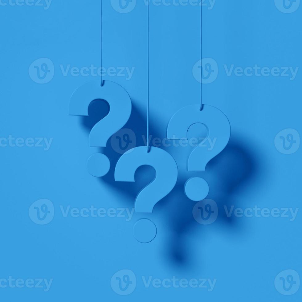 Three blue question marks in front of a blue wall background. FAQ Concept. photo