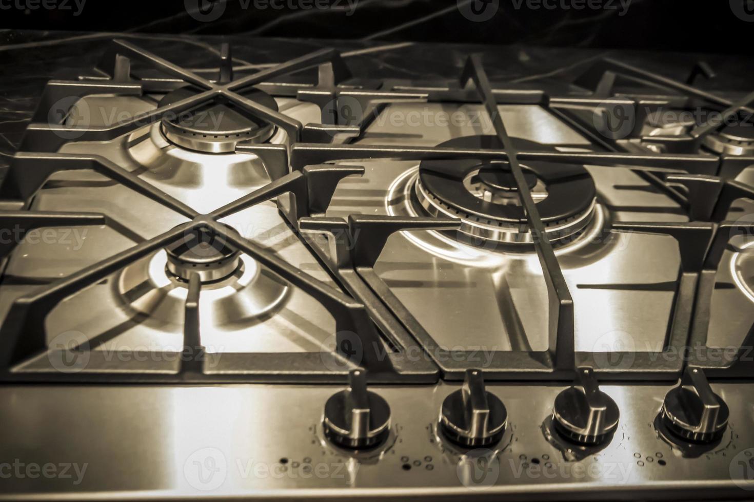 A closeup of details on the top side of a cooker in black and white photo