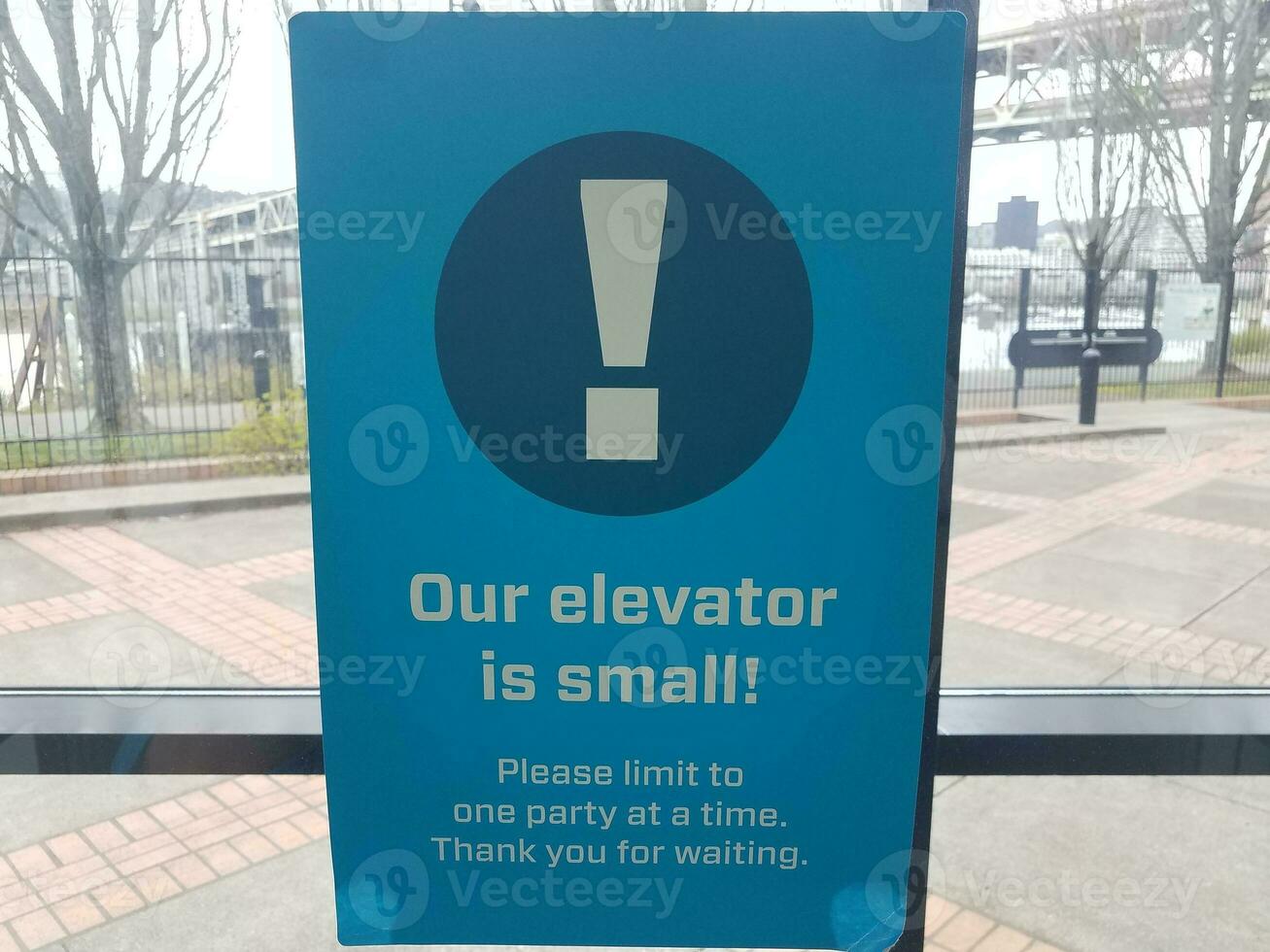 our elevator is small sign covid warning sign photo