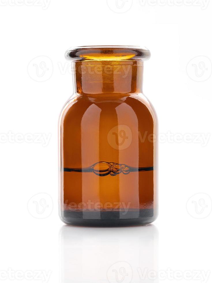 Amber glass bottles for cosmetics, natural medicine , essential oils or other liquids isolated on white background. photo