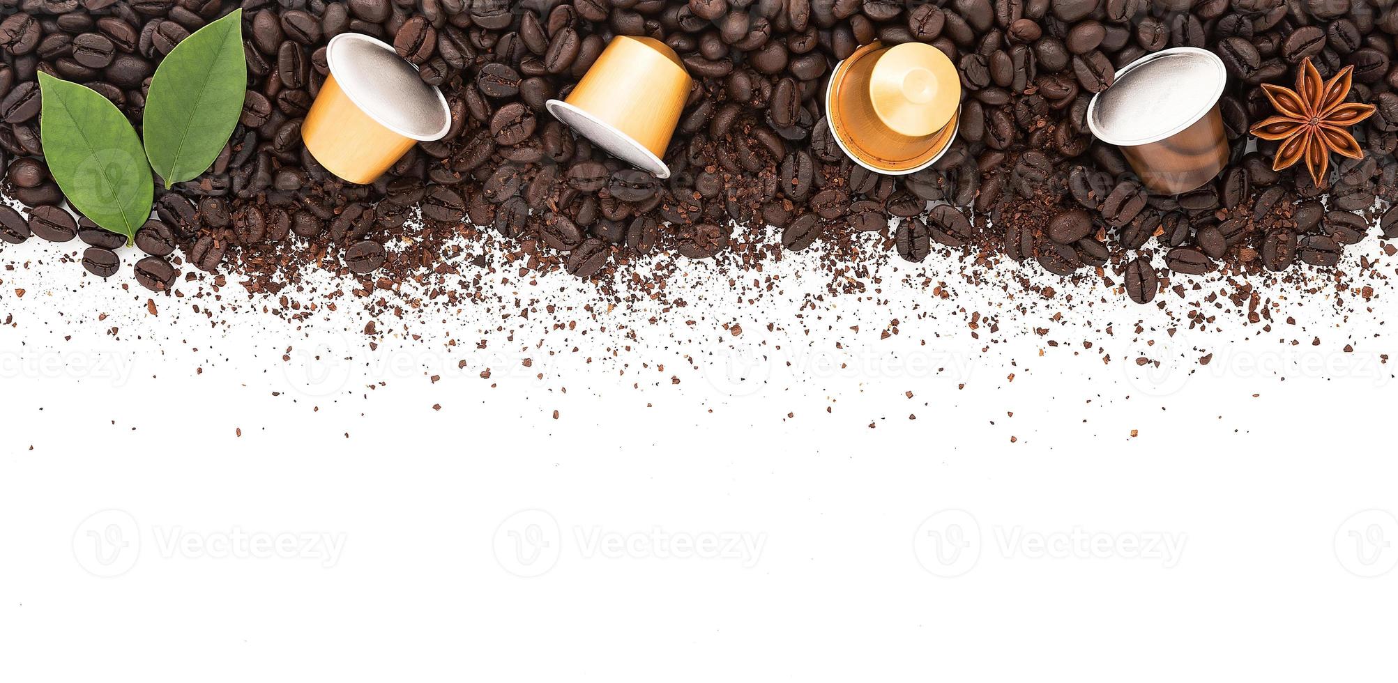 Dark roasted coffee beans setup on white background with copy space. photo