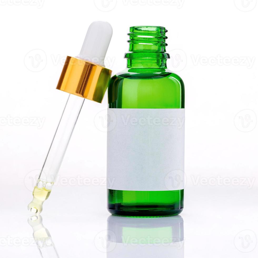 Essential oil bottles with dropper and bubble isolated on white background. photo