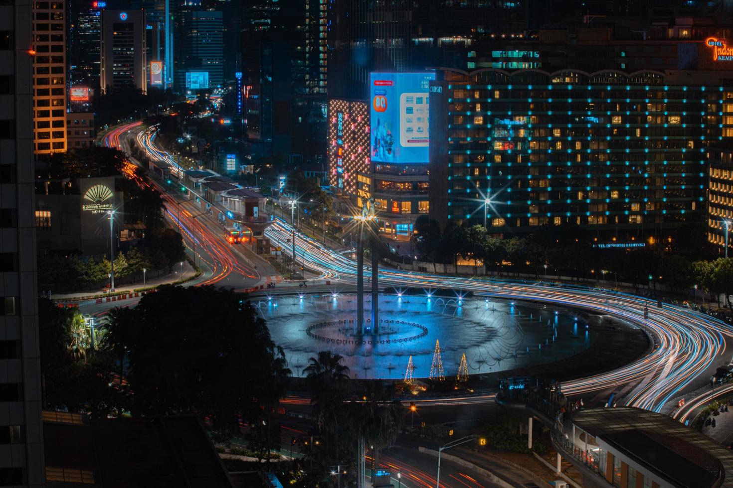 Night cityscape,and traffic light of highway in slow speed shutter motion effect and noise.Jakarta, Indonesia .January 9 2023 photo