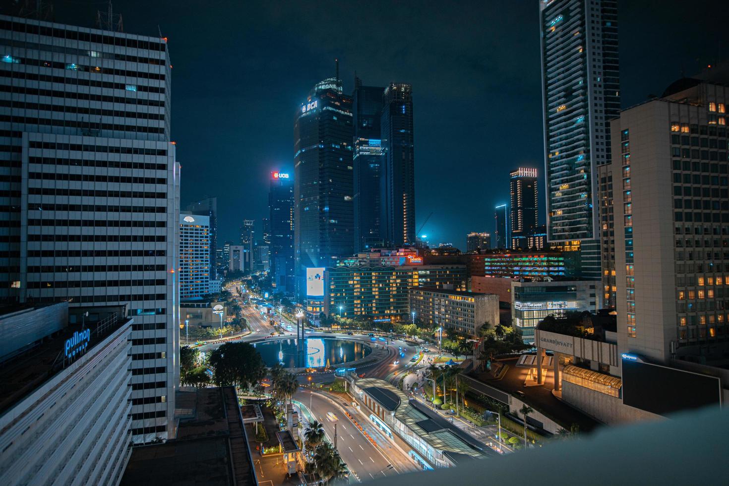 Night cityscape,and traffic light of highway in slow speed shutter motion effect and noise.Jakarta, Indonesia .January 9 2023 photo