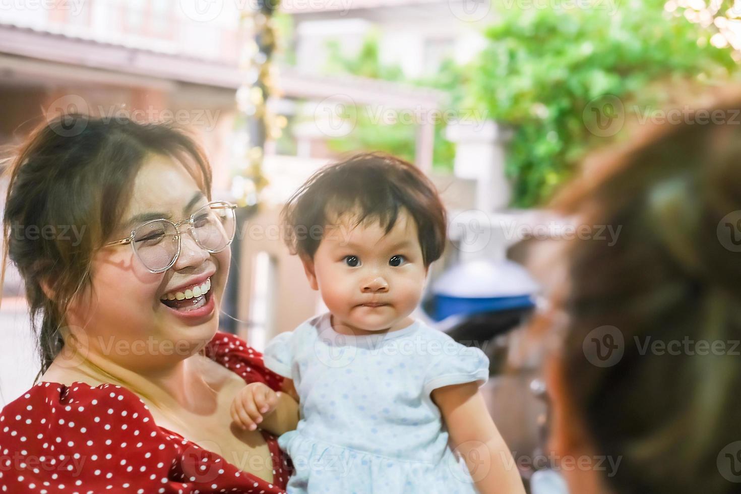 Asian mom smile laugh newborn baby kid eye contact mom smiling cuteness children happy family soft mattress living life healthy lifestyle cute kid baby products health mother baby mother smiling photo