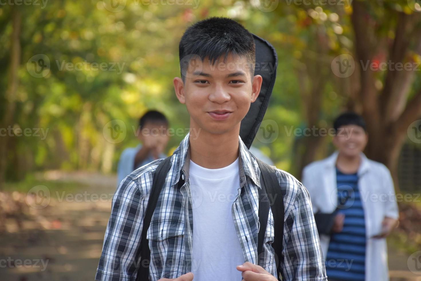 Portrait young asian teens spending freetime together along the way walking to home after music lesson at school, young adult asian couple concept. photo