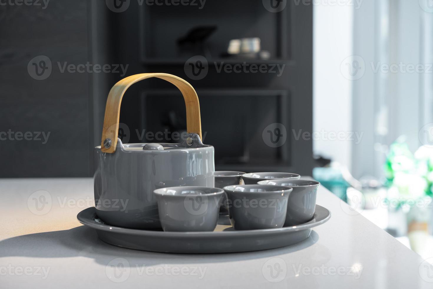 TeaPot ceramic set with New contemporary Modern and Vintage combination style on flat stone kitchen counter with sunlight from window. photo
