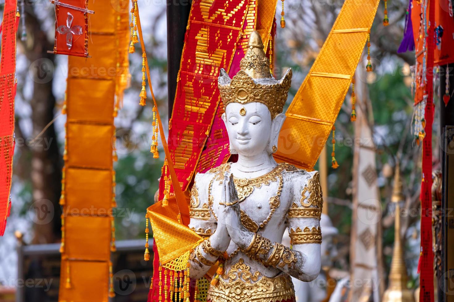 Asia Angel Statue in front of Tung Tree, Traditional Believe of the Victory and Brightness in that area, Wat Phra That Doi Tung, Famous Place in North of Thailand. photo