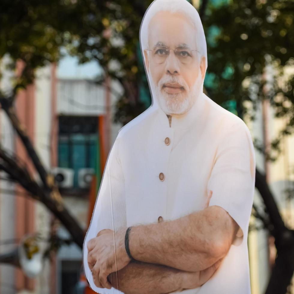 New Delhi, India - January 16 2023 - Prime Minister Narendra Modi cut out during BJP road show, the status of PM Modi while attending a big rally in the capital photo