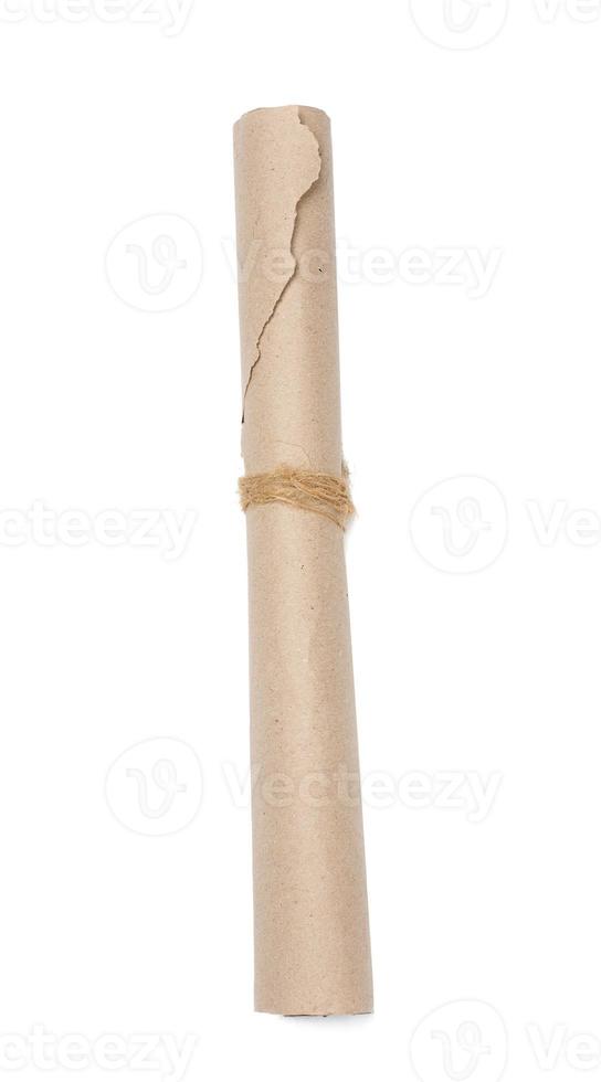 Twisted brown wrapping paper in a roll and tied with a rope on a white background photo