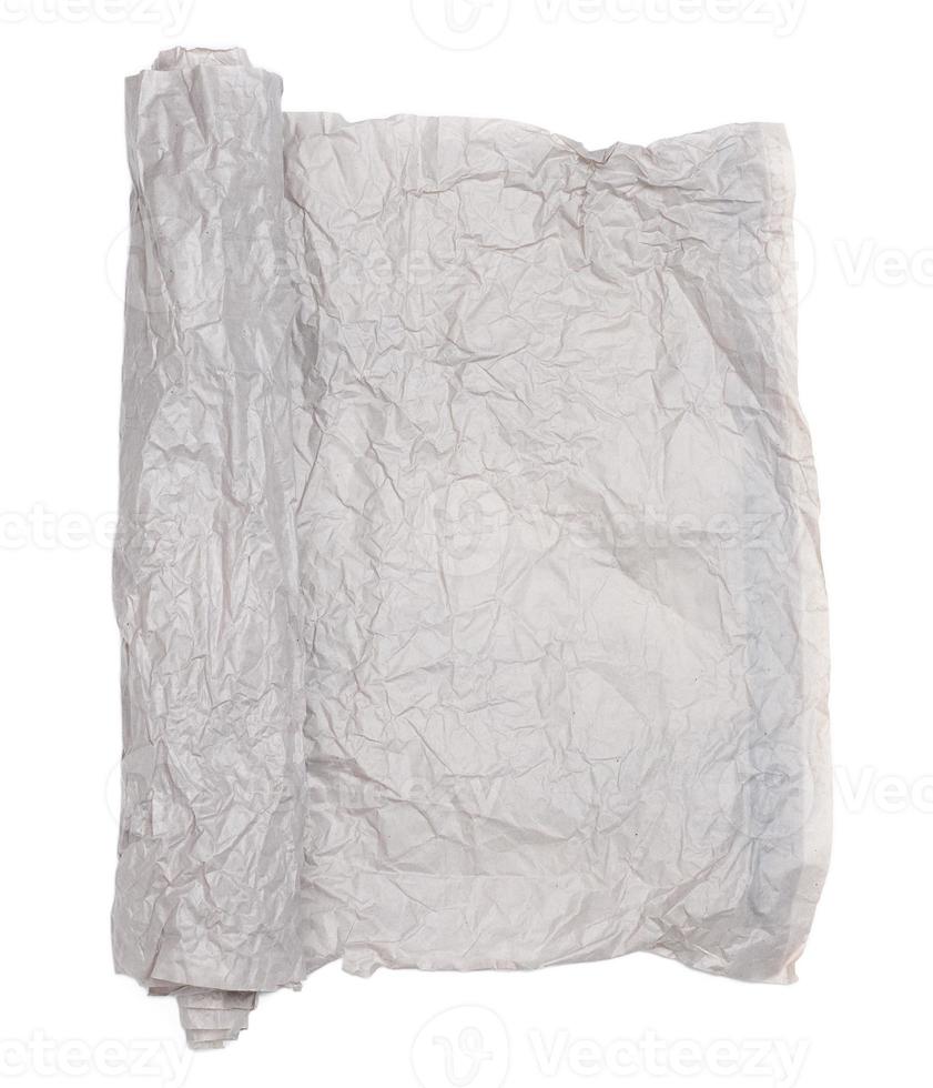 Roll of gray crumpled paper isolated on white background photo