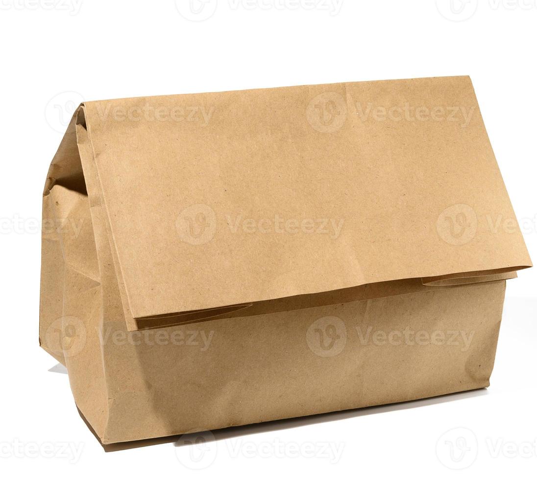 Full brown paper bag on a white background photo