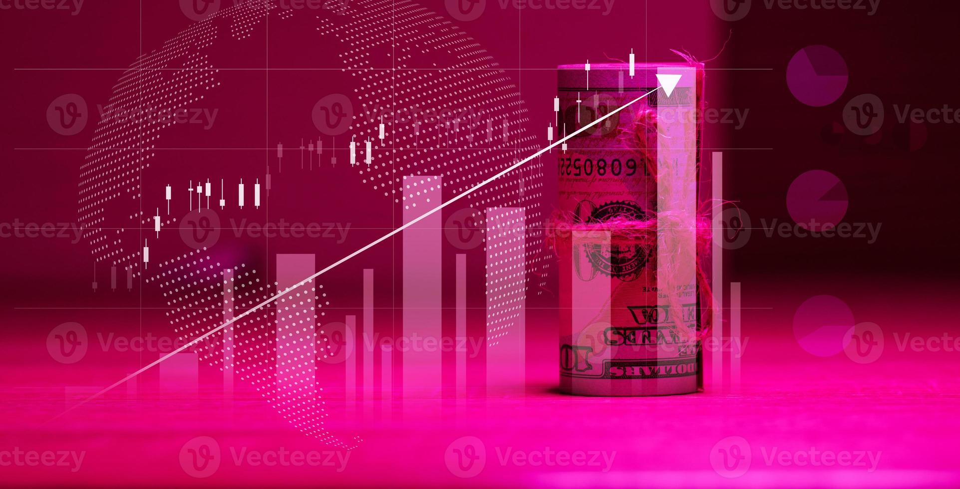 A roll of one hundred dollar bills tied with a rope and a graph with rising rates. Income growth concept, high margin, profitable business photo