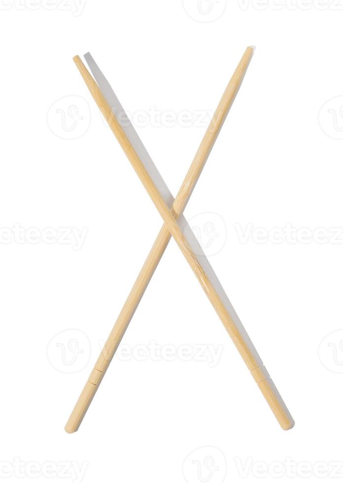 Two wooden chopsticks on a white isolated background, top view photo